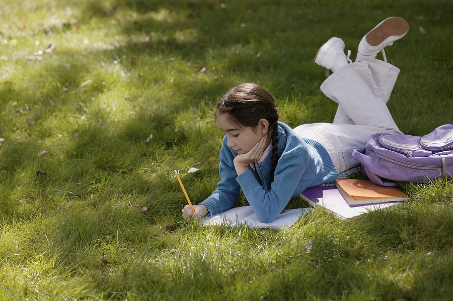 Girl studying outdoors #1 Photograph by Comstock Images