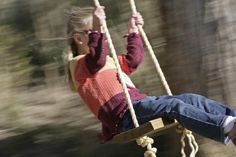 Girl swinging #1 Photograph by Comstock Images