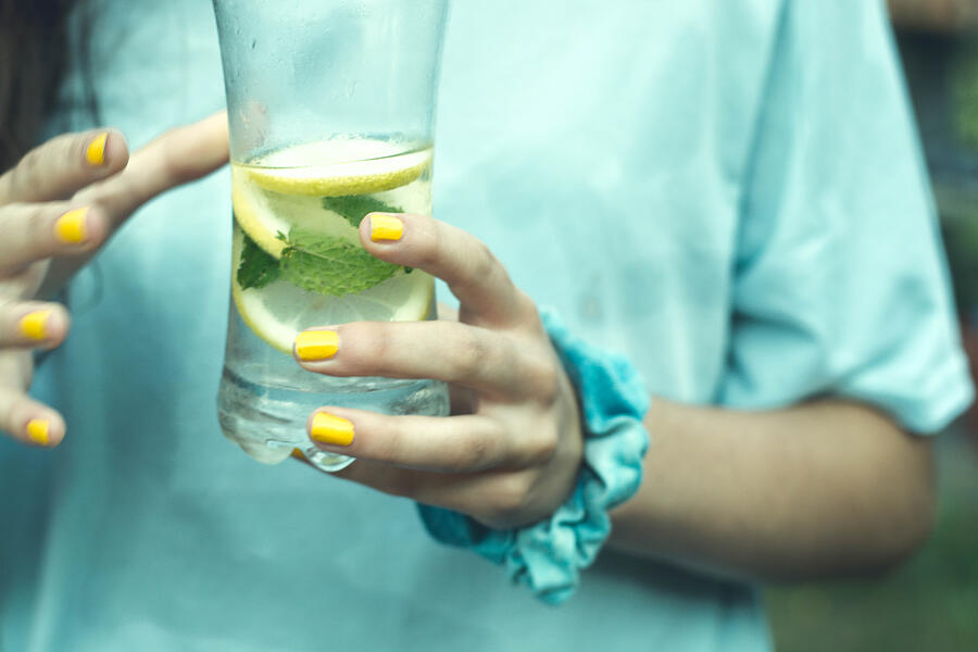 Girl With A Glass Of Water With Lemon And Mint #1 Photograph by Crispin la valiente