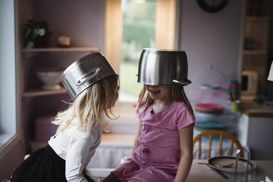 Girls wearing pots #1 Photograph by Johner Images