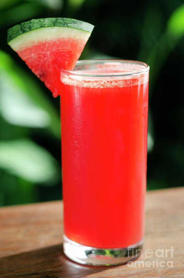Glass Of Fresh Organic Watermelon Juice On Table Outdoors #1 Photograph by JM Travel Photography