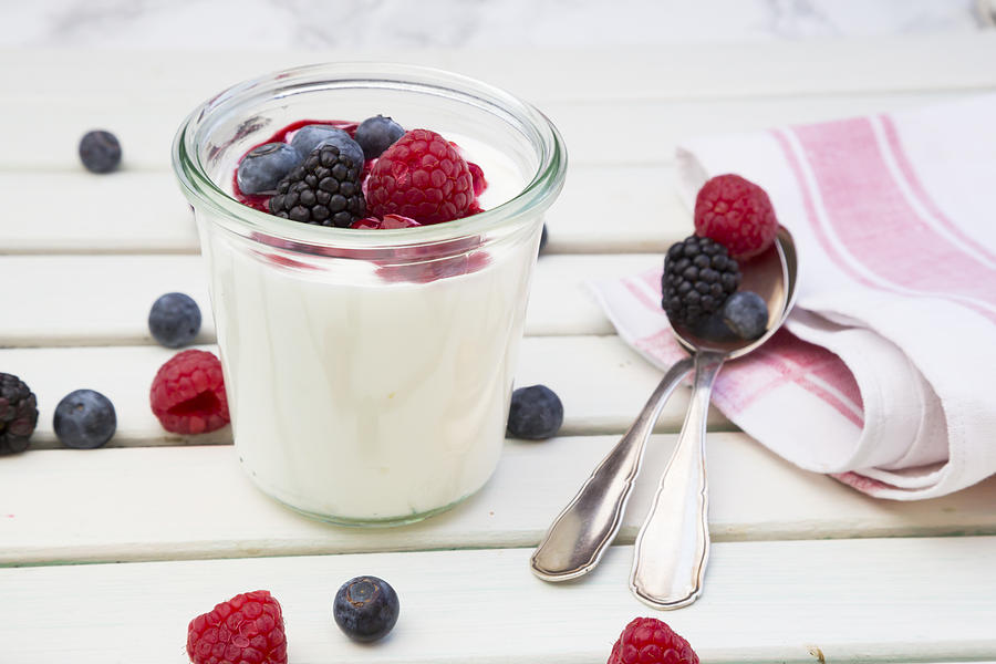 Glass of Greek yogurt with berries #1 Photograph by Westend61