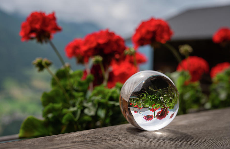 Glass Sphere Lying On A Wooden Balcony Photograph