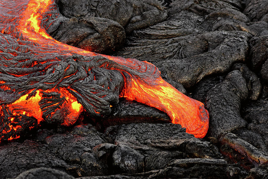 Glowing lava emerges from a column of the earth Photograph by Ralf Lehmann