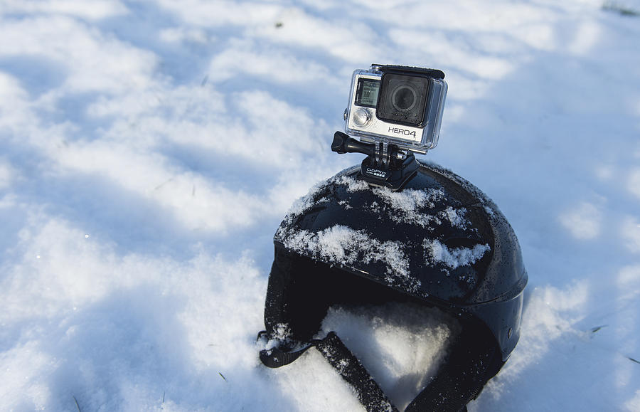 GoPro Hero 4 Black Edition mounted on skiing helmet #1 Photograph by Mikkelwilliam