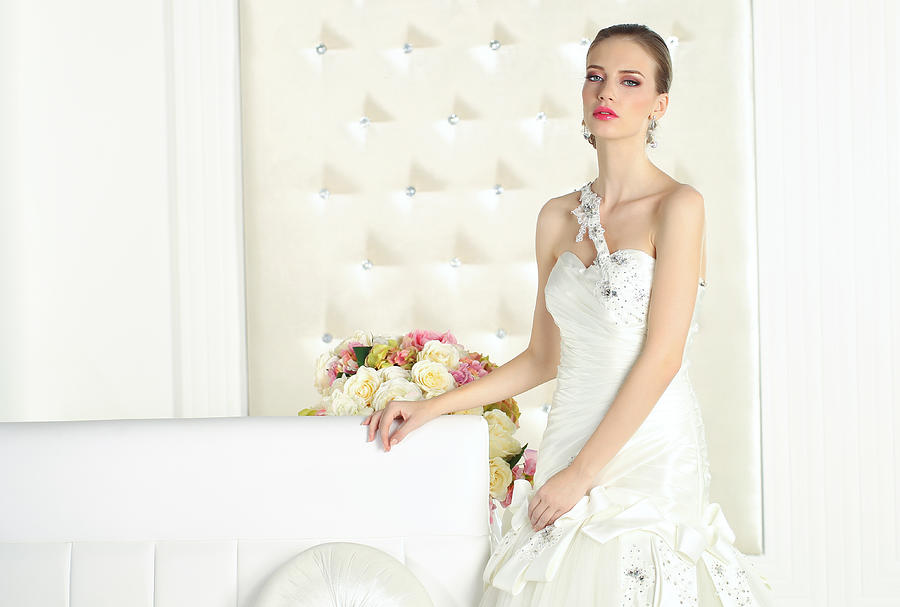 Gorgeous bride in a white room, posing #1 Photograph by Hreni