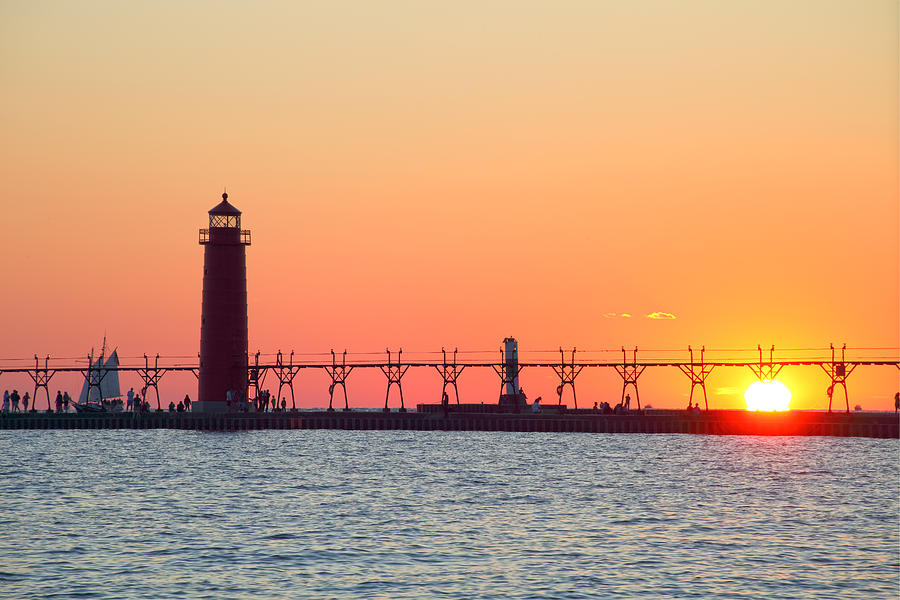 Grand Haven Pier Lighthouse (1905) on Lake Michigan at sunset #1 Photograph by Rainer Grosskopf