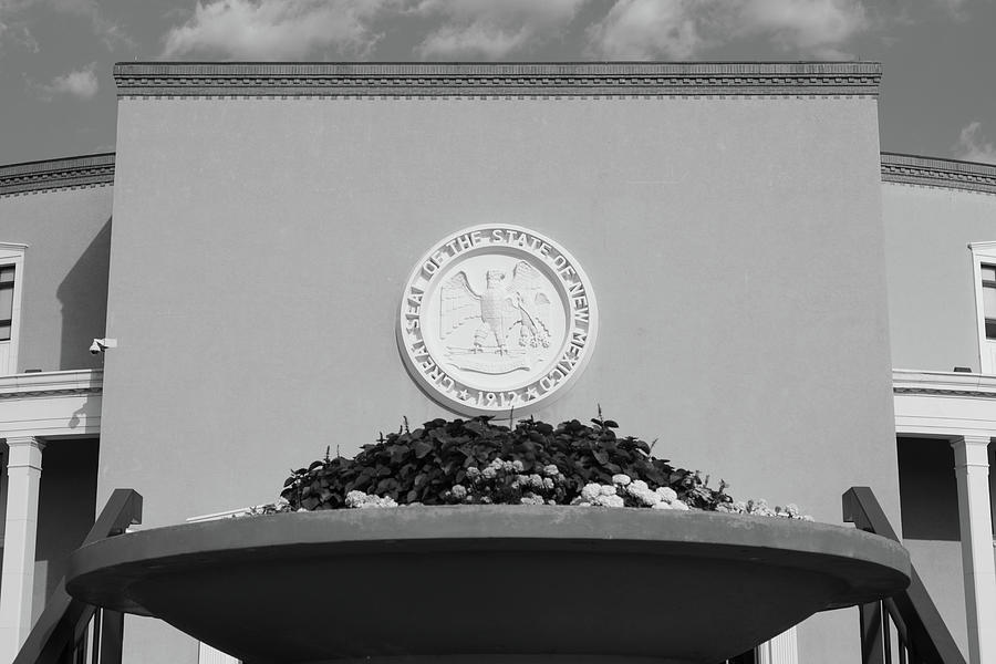 Great seal of New Mexico on the side of the state capitol in Santa Fe New Mexico in black and white #1 Photograph by Eldon McGraw