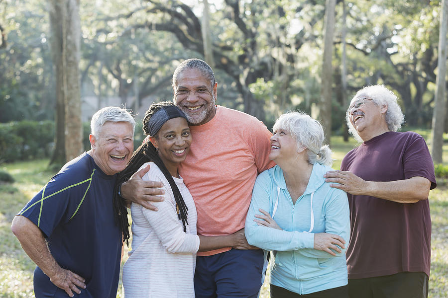 Group of five multi-ethnic seniors standing in park #1 Photograph by Kali9
