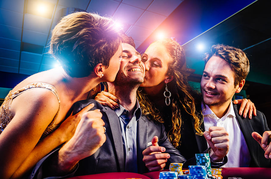 Group of friends winning at Casino #1 Photograph by FilippoBacci