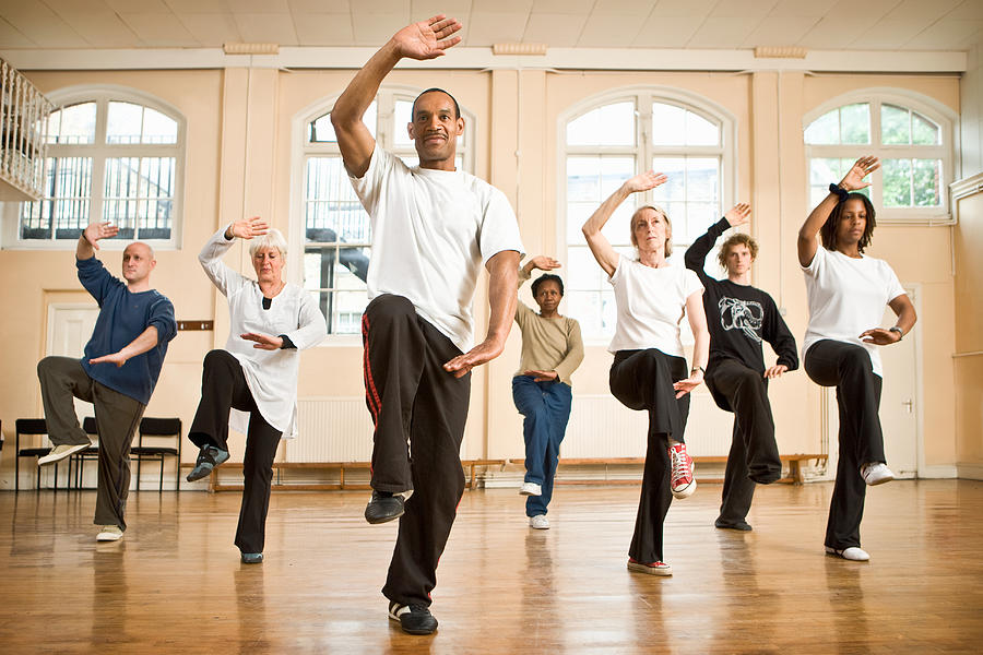Group of mature and senior people practicing Tai Chi #1 Photograph by Tim Platt