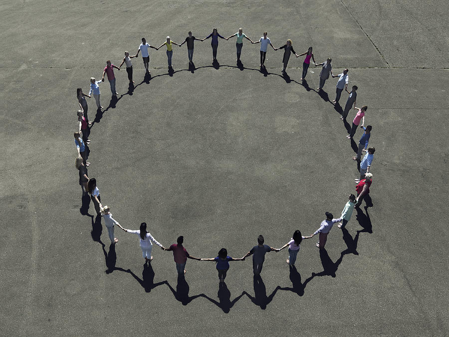 Group of people forming a circle #1 Photograph by Henrik Sorensen