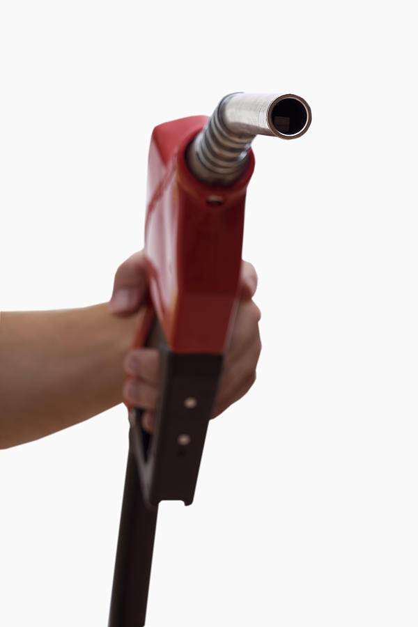 Hand holding a gas pump #1 Photograph by Comstock Images