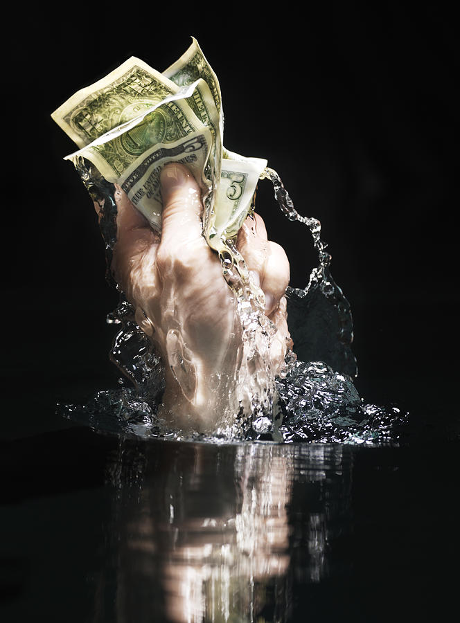 Handfull Of Us Dollars In Water #1 Photograph by Henrik Sorensen