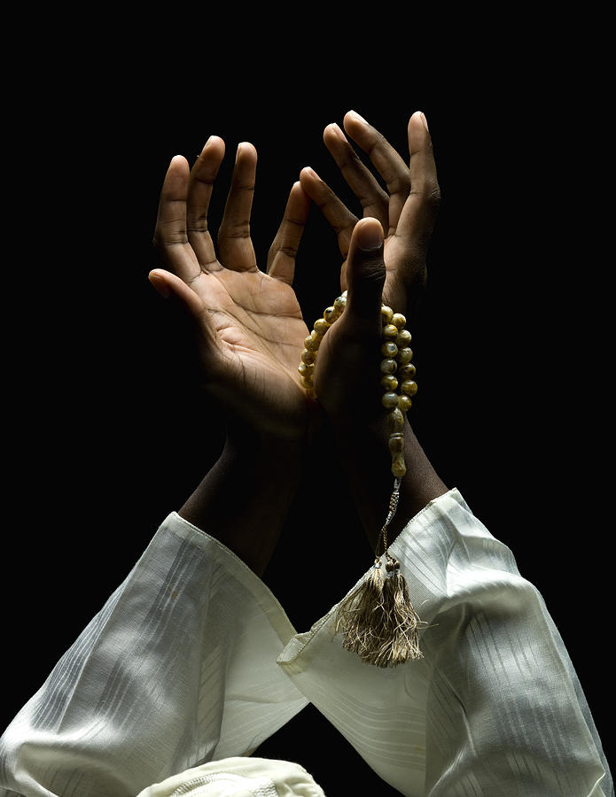Hands Holding A Muslim Rosary #1 Photograph by Juanmonino