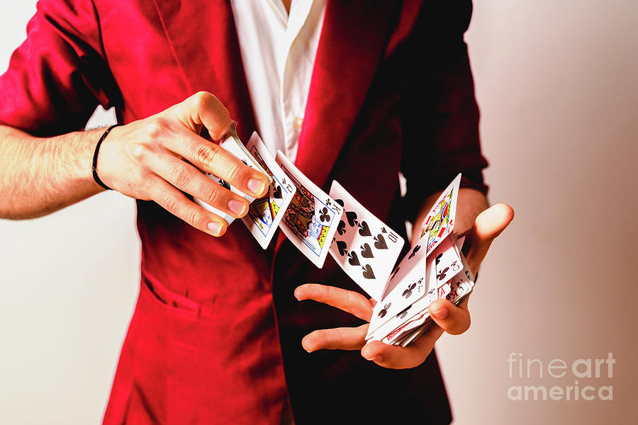 Hands of magician doing tricks with a deck of cards. #1 Photograph by Joaquin Corbalan