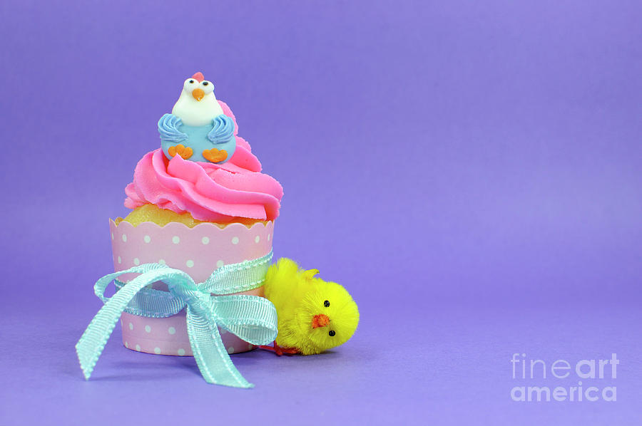 Easter Photograph - Happy Easter pink, yellow and blue cupcakes with cute chicken decorations #1 by Milleflore Images