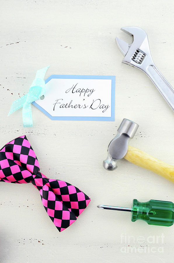 Happy Fathers Day concept with mens tools and pink bow tie.  #1 Photograph by Milleflore Images