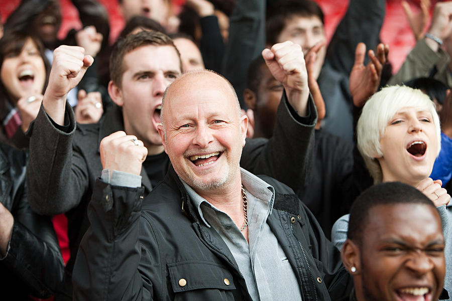 Happy man at football match #1 Photograph by Image Source