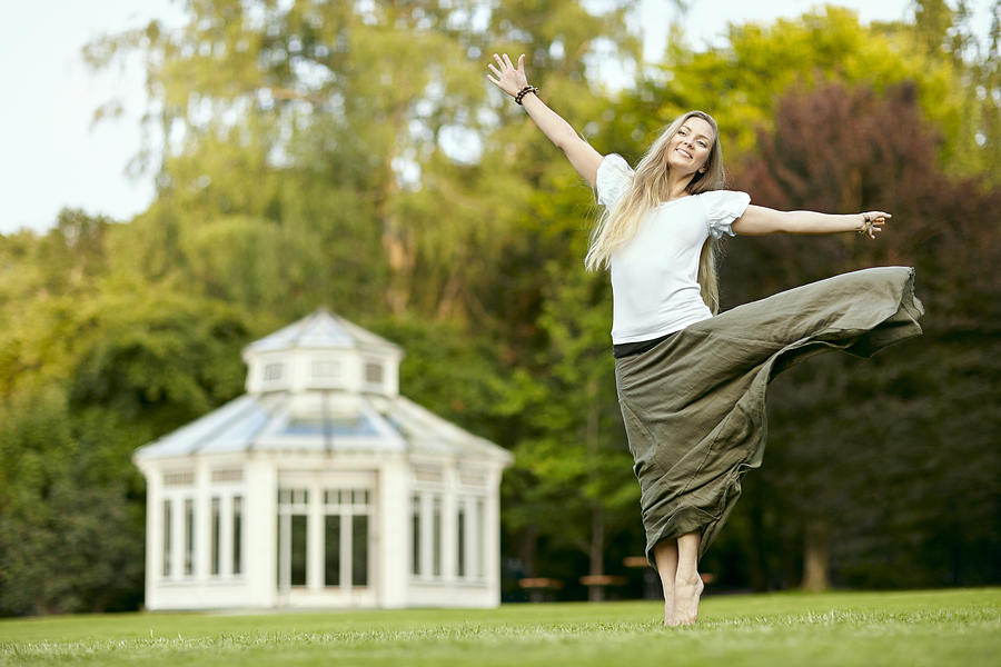 Happy woman in park #1 Photograph by Johner Images