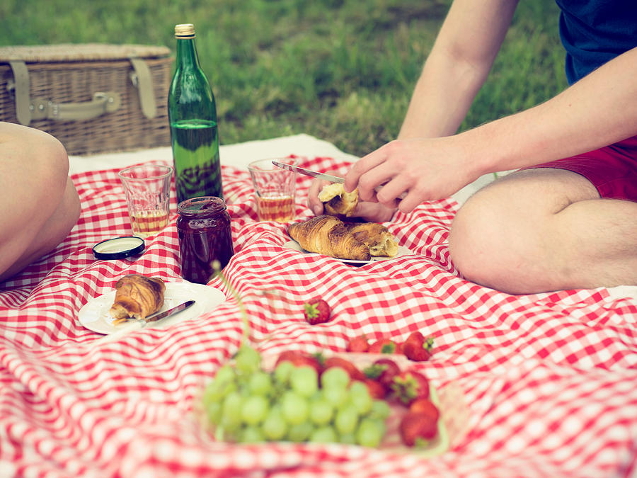 Having picnic in meadow. #1 Photograph by Guido Mieth