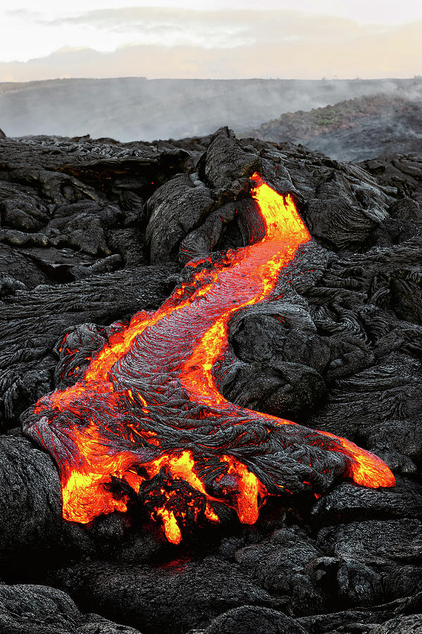 Hawaii - lava emerges from a column of the earth Photograph by Ralf Lehmann