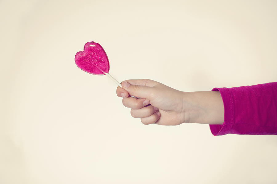 Heart-shaped lollipop #1 Photograph by Cristinairanzo