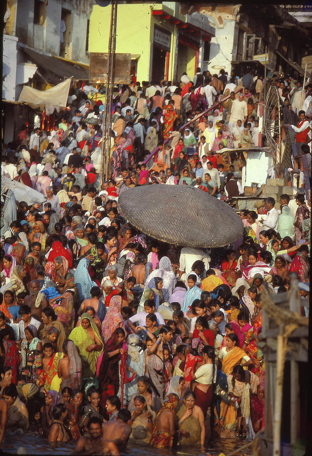 Hindu pilgrims bathe in the Ganges #1 Photograph by Steve Estvanik