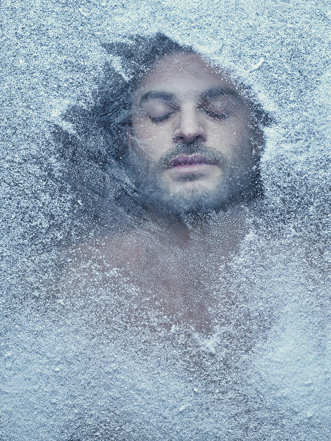Hispanic man behind snow covered window #1 Photograph by Colin Anderson Productions pty ltd