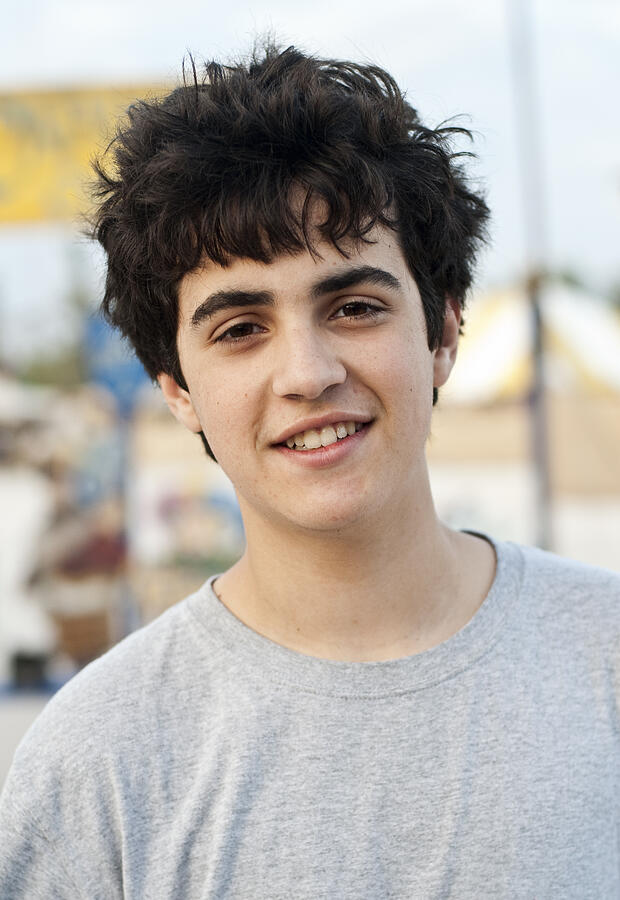 Hispanic Teenage Boy Smiling #1 Photograph by Juanmonino