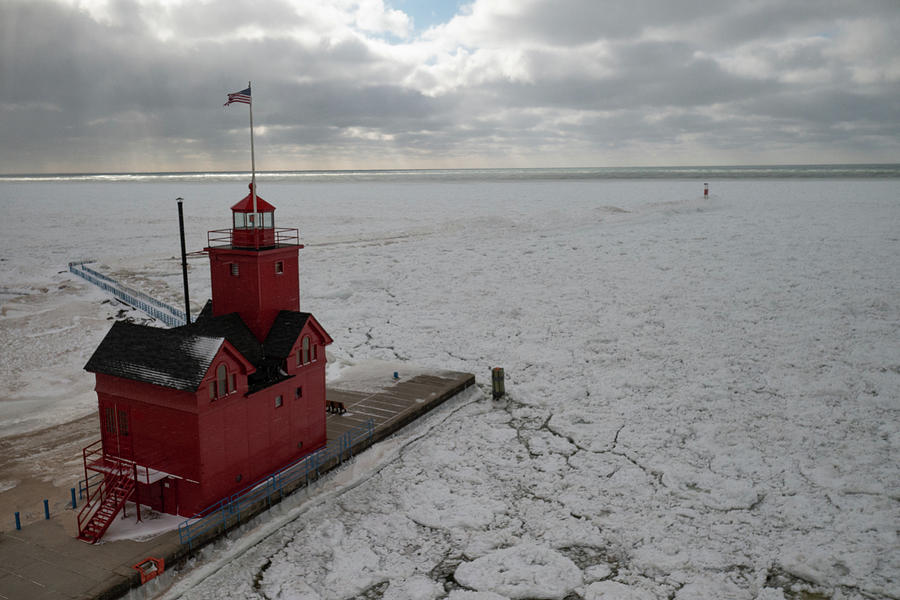 Holland Michigan Lighthouse in the winter #1 Photograph by Eldon McGraw