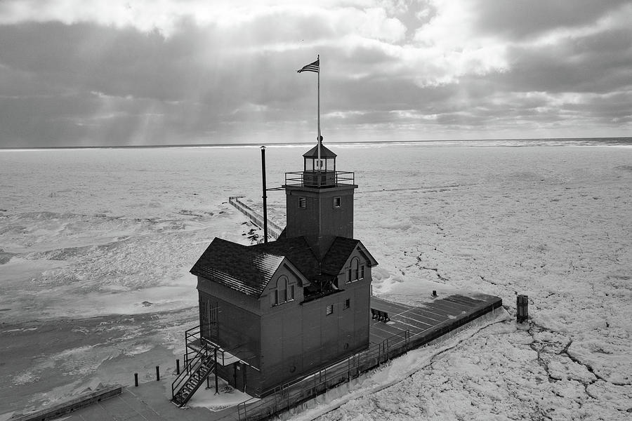Holland Michigan Lighthouse in the winter in black and white #1 Photograph by Eldon McGraw