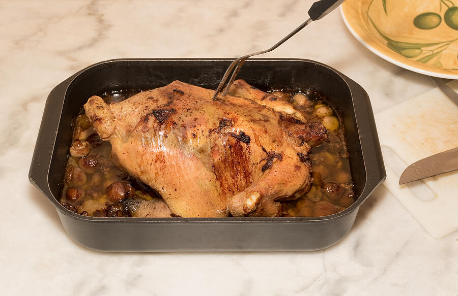 Homemade roast whole chicken in one dish #1 Photograph by Jean-Marc PAYET