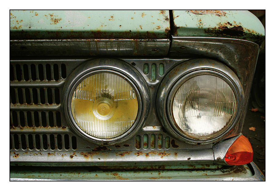 Hood and headlights of an abandoned classic car Photograph by Yury