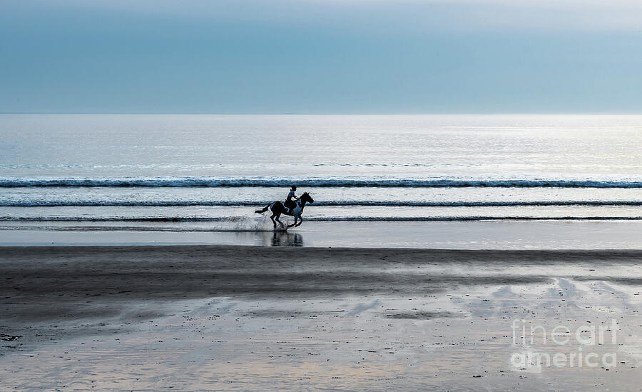 Horse Rider Galopping At Newgale Beach At The Atlantic Coast Of Pembrokeshire In Wales, United Kingd #1 Photograph by Andreas Berthold