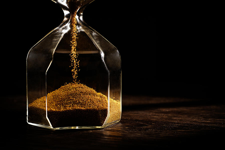 Hourglass with golden sand #1 Photograph by Jordan Lye
