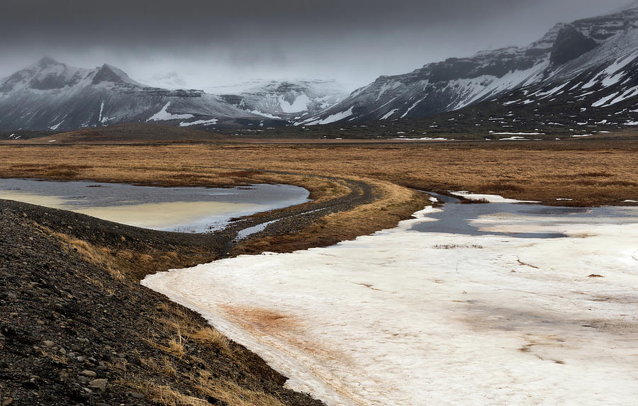  Icelandic landscape with frozen lake and mountains covered in snow #1 Photograph by Michalakis Ppalis