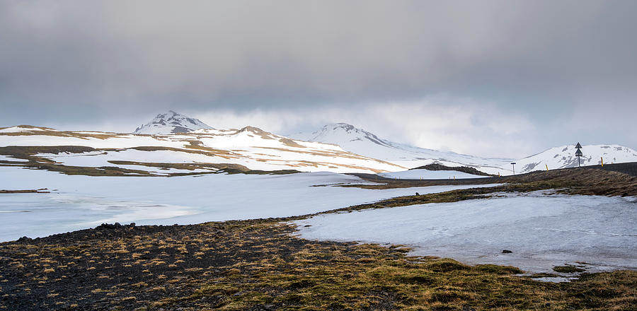 Icelandic landscape with mountains and meadow land covered in snow. Iceland Photograph by Michalakis Ppalis