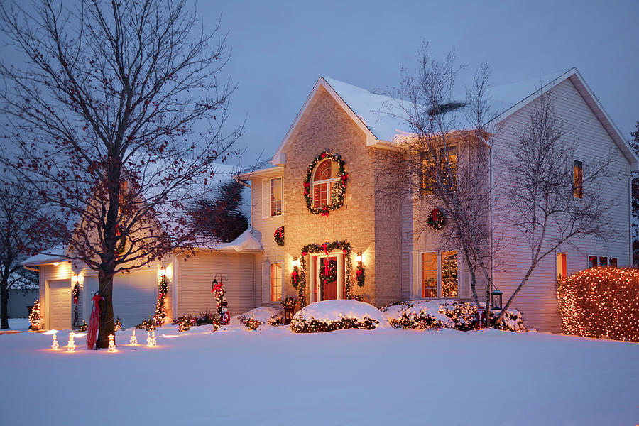 Idyllic holiday home decorated with Christmas lights Photograph by ...