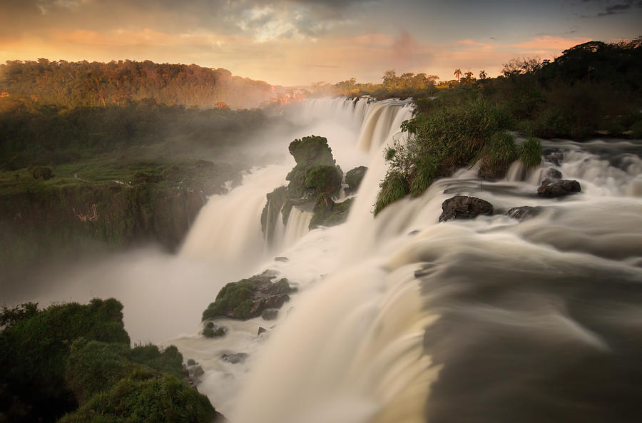 Iguazu falls waterfalls at sunset. #1 Photograph by Alex Saberi