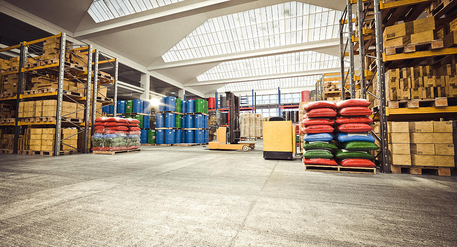 Interior Of A Storage Warehouse With Means For Moving Goods #1 Photograph by Gualtiero Boffi