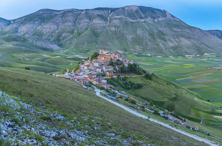 Italy, Umbria, Monti SIbillini National Park, the small town of Castelluccio di Norcia and the Vettore mountain at sunset #1 Photograph by Westend61