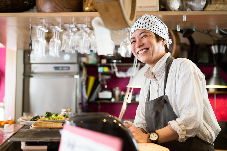 Japanese woman chef who shows a smile in the kitchen #1 Photograph by Taiyou Nomachi