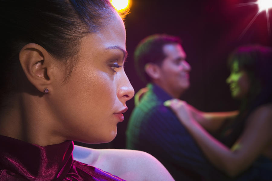 Jealous Hispanic woman in nightclub #1 Photograph by Jose Luis Pelaez Inc
