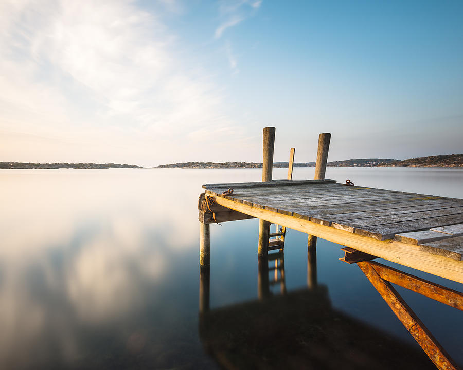 Jetty at lake #1 Photograph by Johner Images