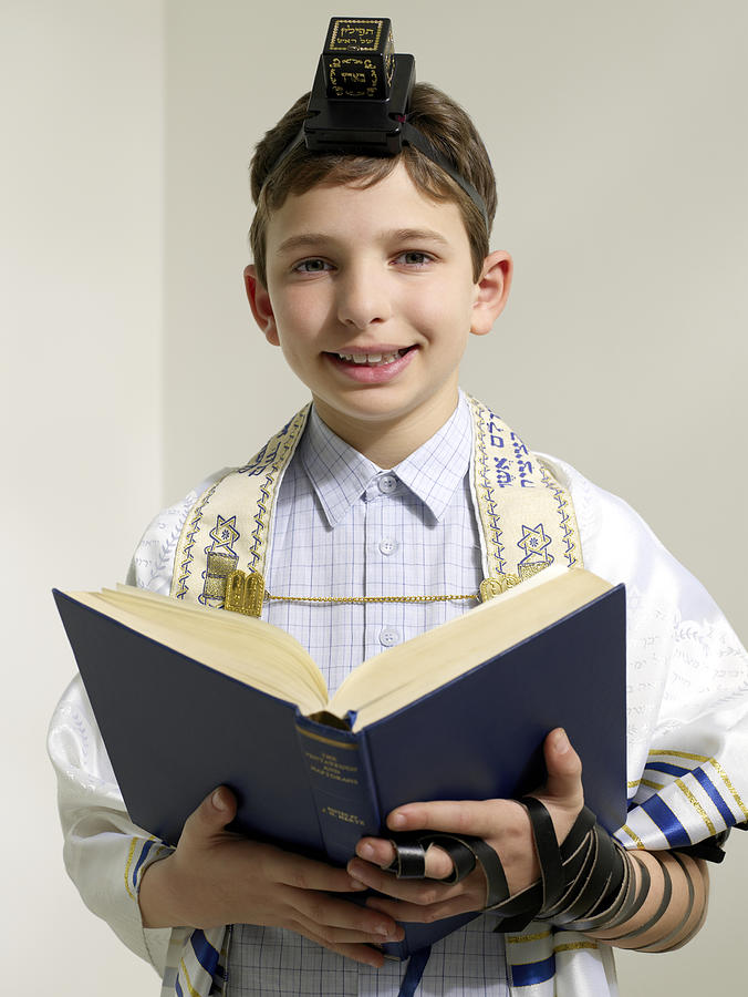 Jewish boy reading from siddur #1 Photograph by Image Source