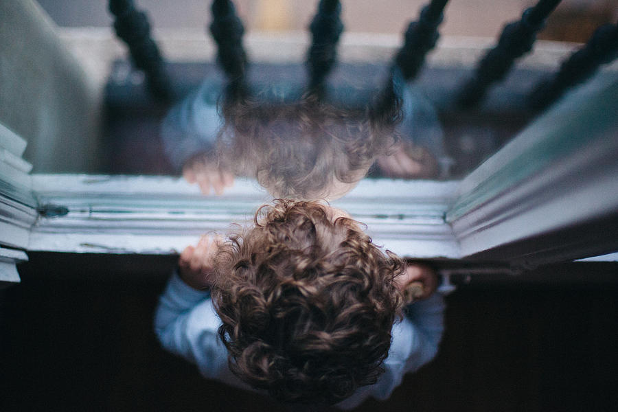 Kid looking through the window #1 Photograph by Orbon Alija