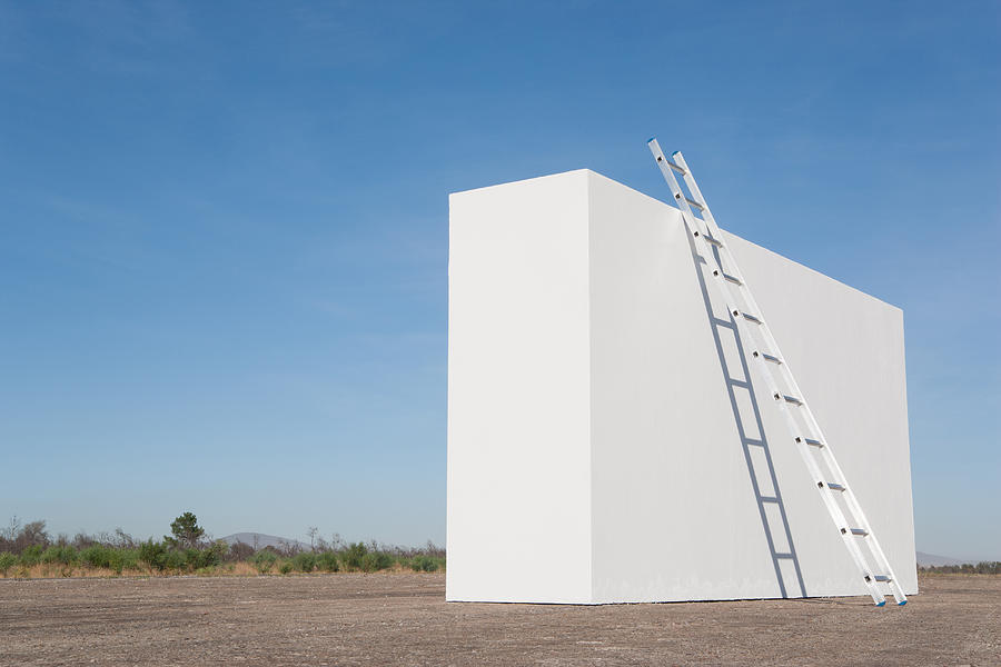Ladder against white wall outdoors #1 Photograph by Martin Barraud