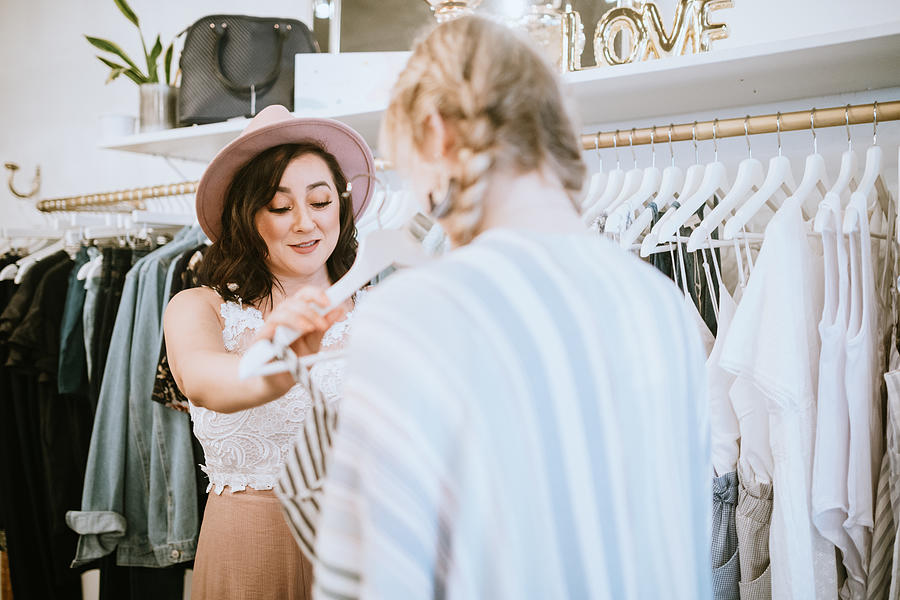 Latina Boutique Store Owner Assisting Customer #1 Photograph by RyanJLane