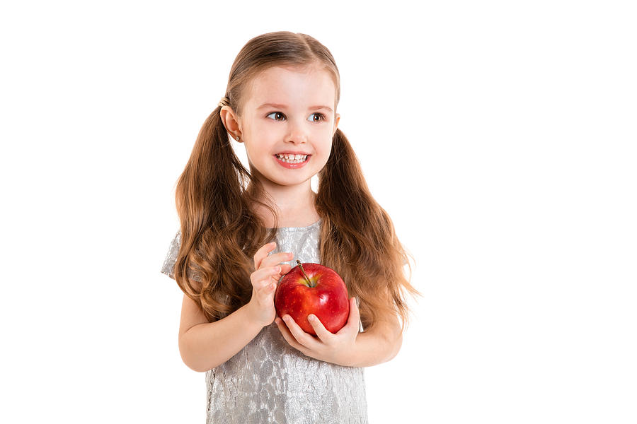 Little Girl With Apple(isolated On White Background, Isolated) #1 Photograph by Kertlis